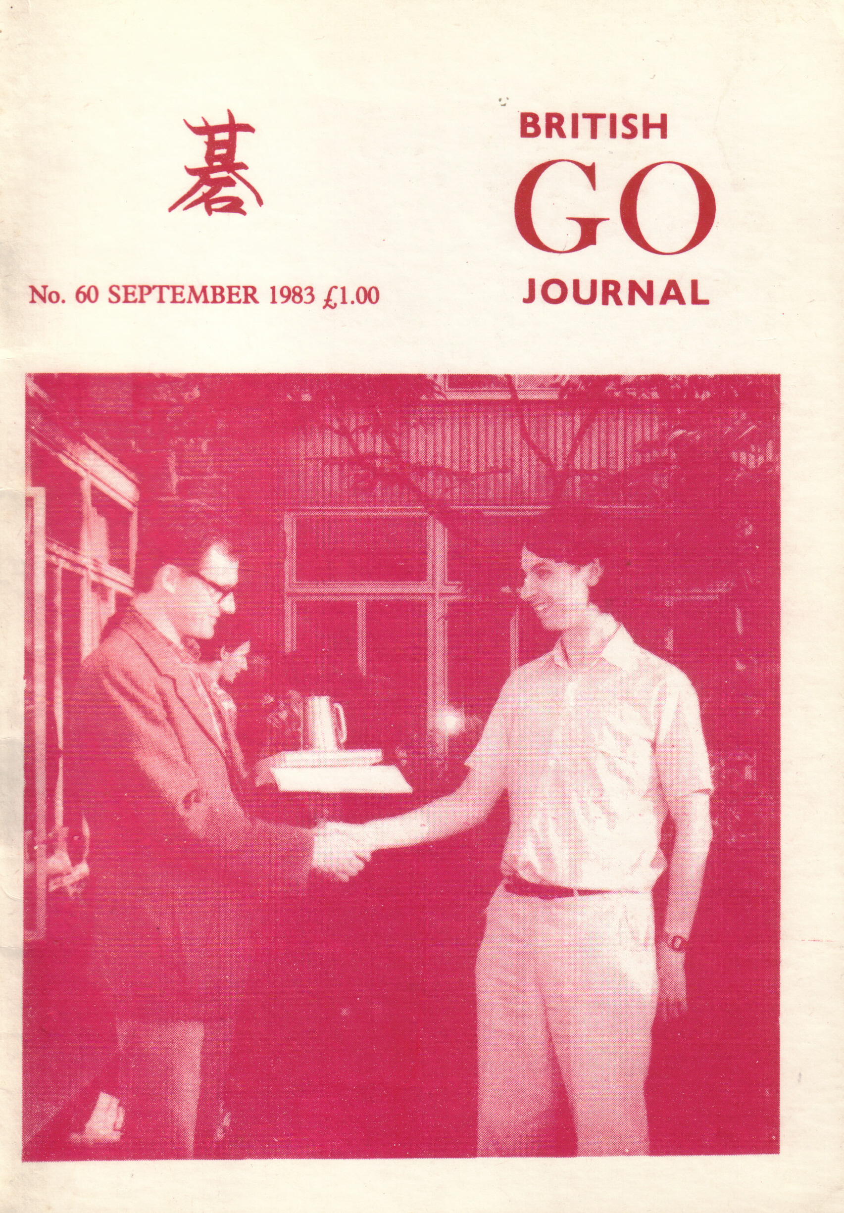Okładka British Go Journal no. 60 (wrzesień 1983) - Janusz Kraszek (po lewej) przyjmuje gratulacje od Richarda Granville